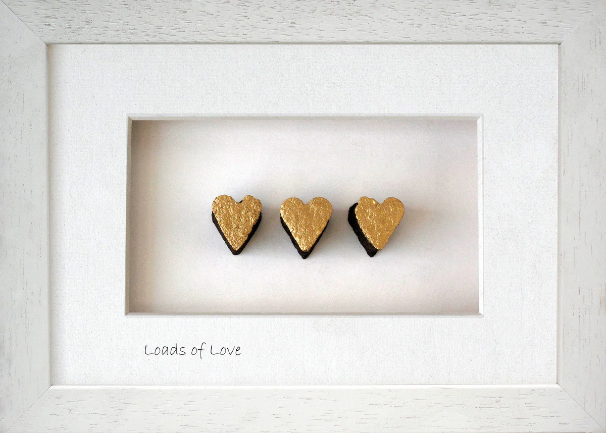 three love hearts made from Irish bog in a frame